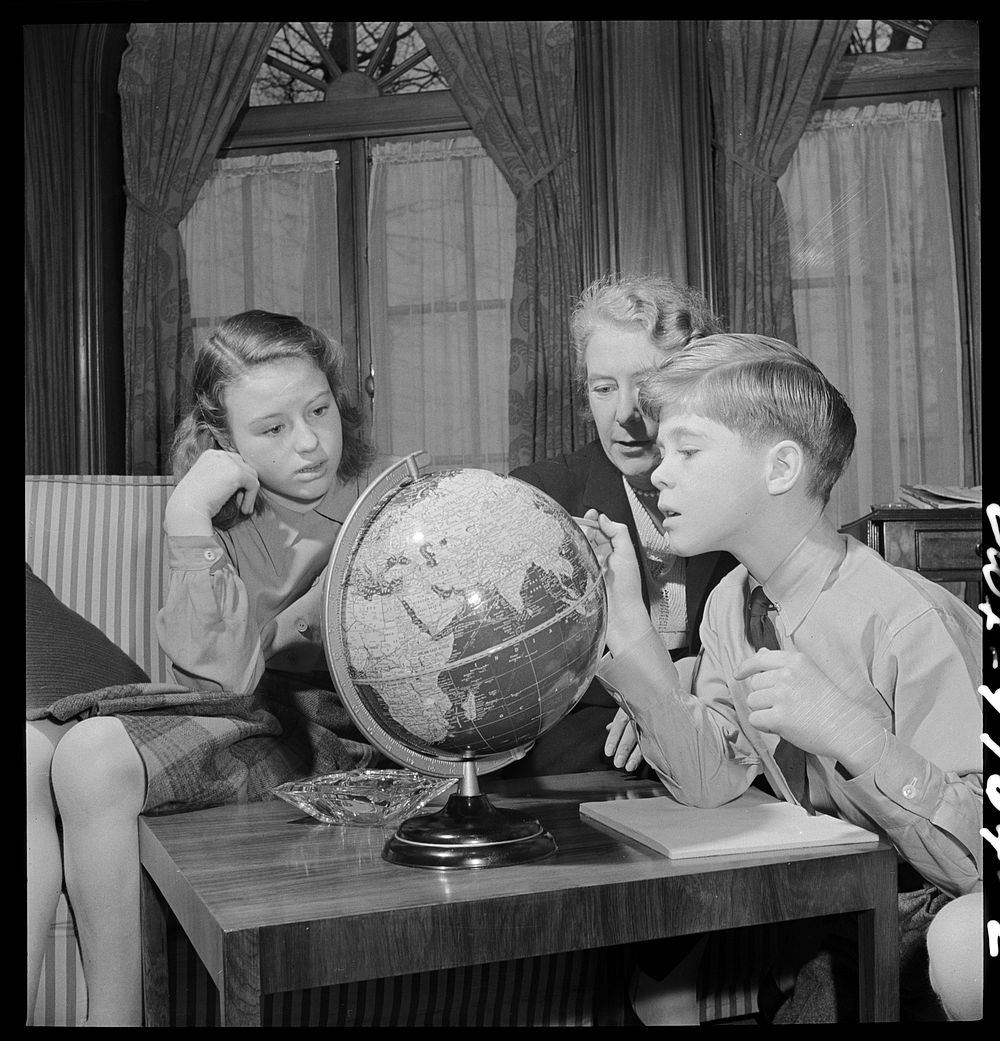 Washington, D.C. The Australian Legation. Mrs. Casey, wife of the minister, examining a globe with her son and daughter.…