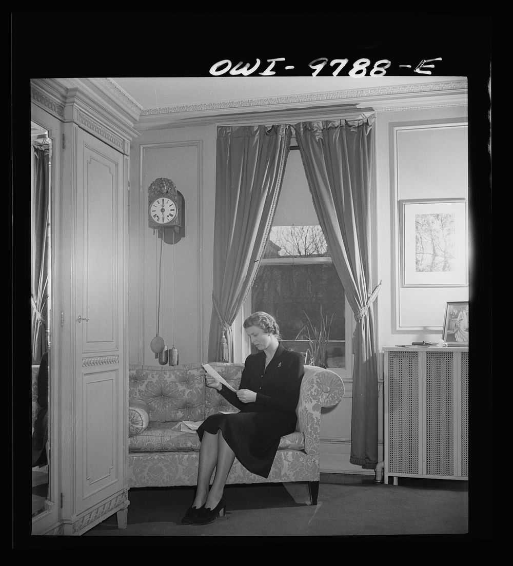 [Untitled photo, possibly related to: Washington, D.C. The Netherlands Legation. Minister Louden's daughter examining a…