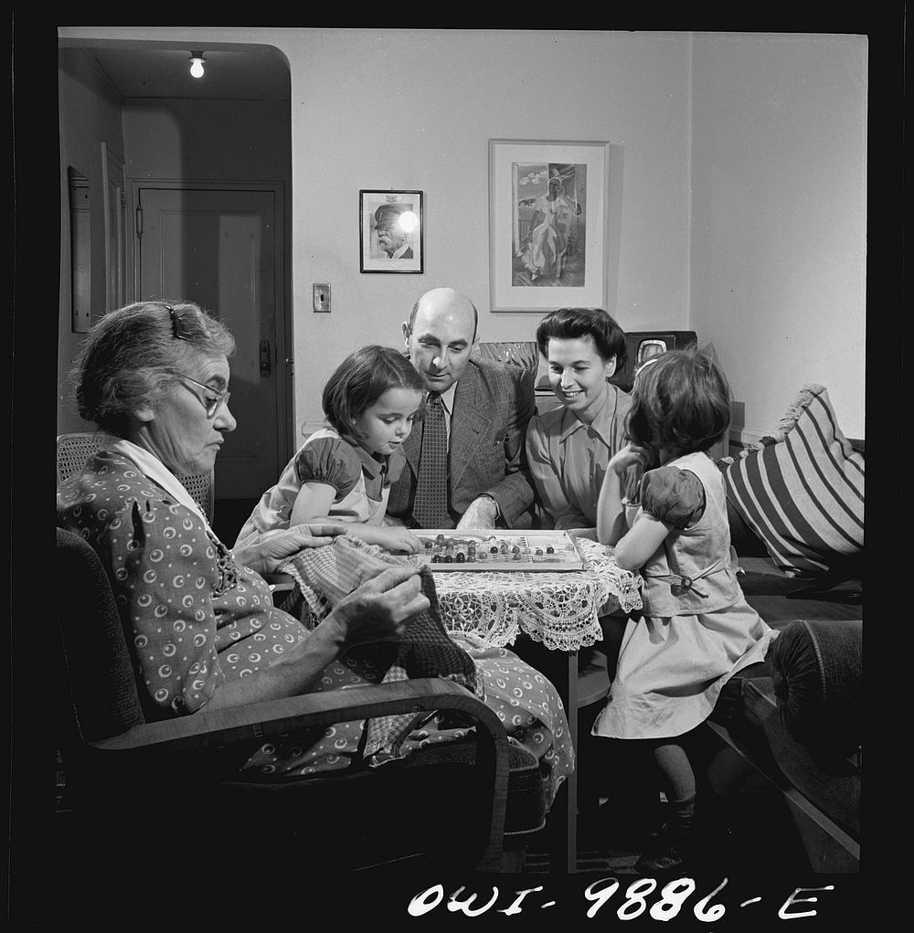 New York, New York. Dr. and Mrs. Winn [or Wynn], Janet and Marie, a Czech-American family, playing Chinese checkers while…