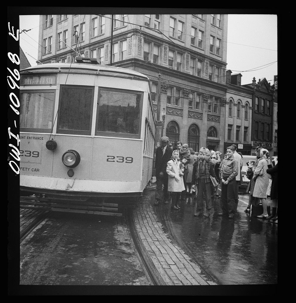 [Untitled photo, possibly related to: Lancaster, Pennsylvania. Boarding buses on a rainy market day]. Sourced from the…