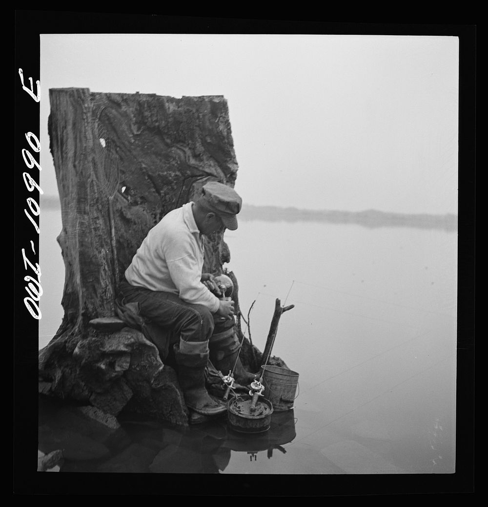 Lancaster County, Pennsylvania. Fishing for salmon on the Susquehanna River at 6 p.m. This man is a state supervisor of…