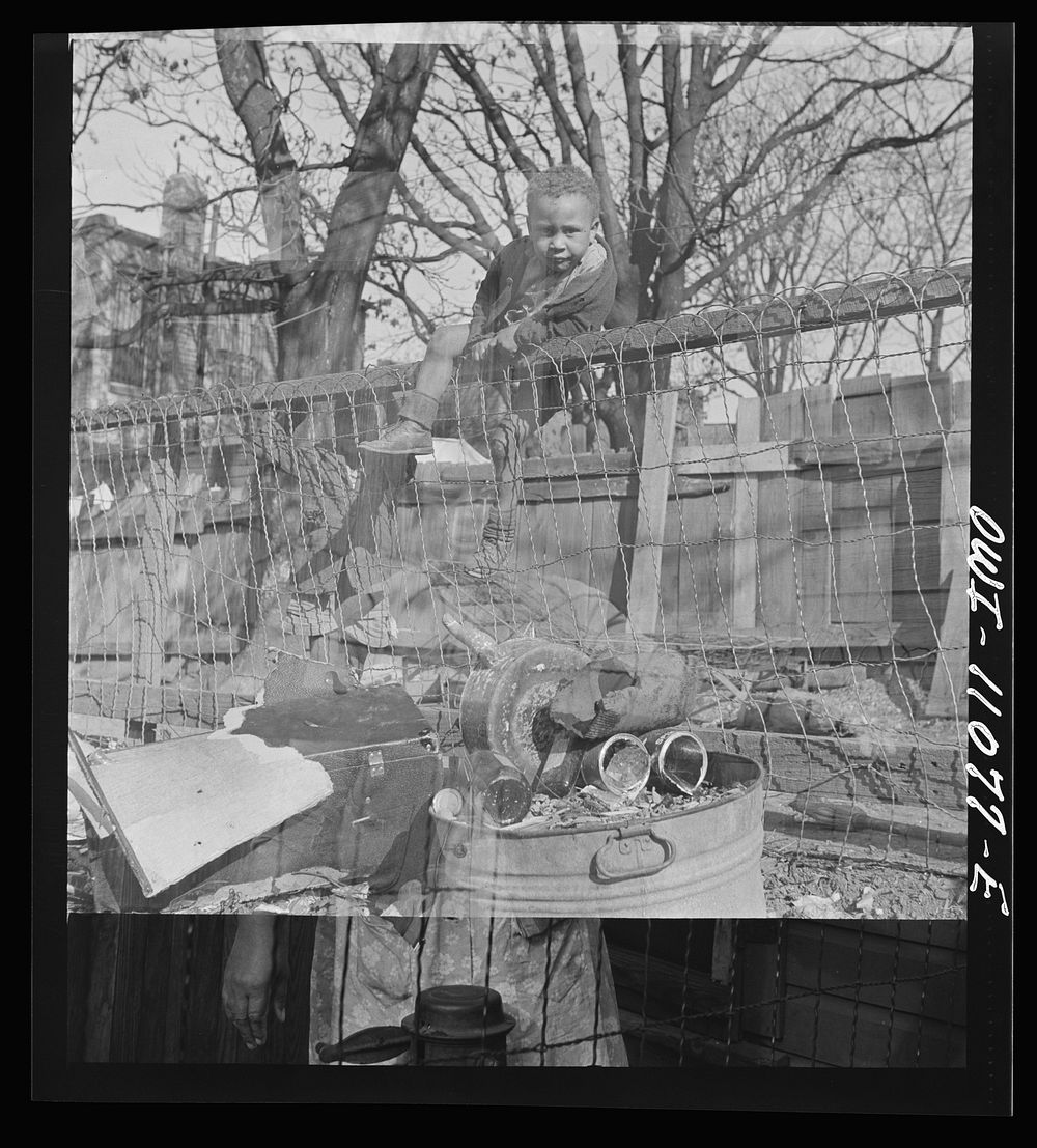 [Untitled photo, possibly related to: Washington (southwest section), D.C. Two boys playing in their backyard]. Sourced from…