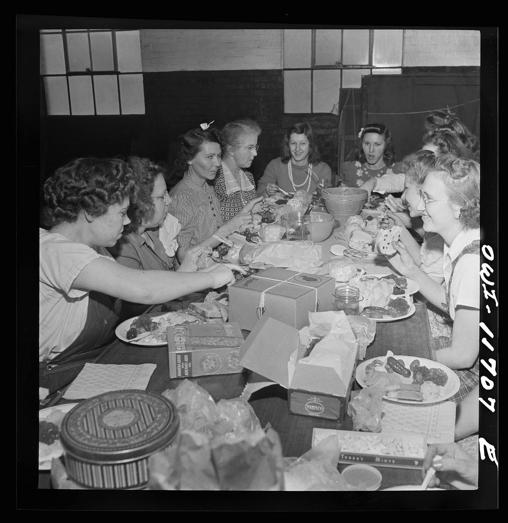 Lititz, Pennsylvania. Girls working at the Animal Trap Company treating themselves to a special lunch to celebrate the…