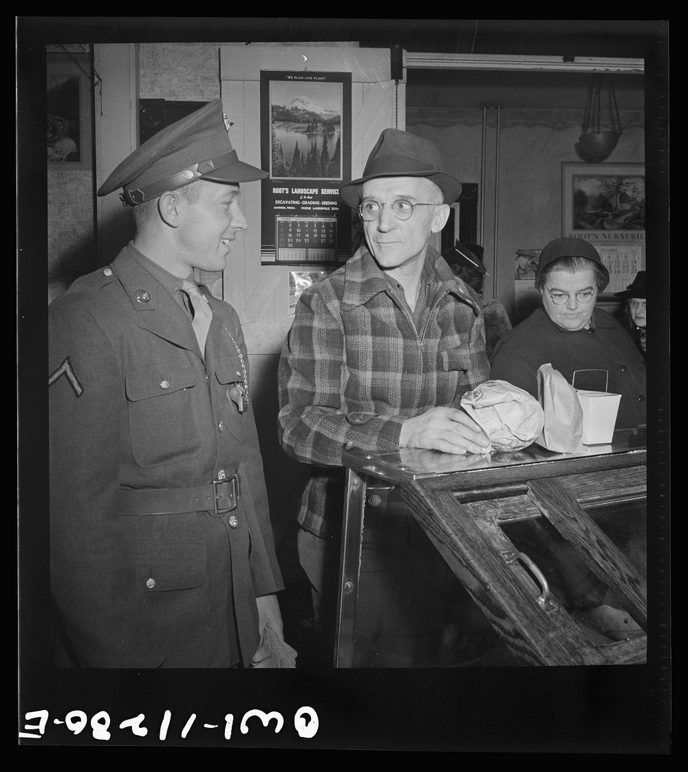 Lititz, Pennsylvania. Private first class Fred D. Long, home on leave from Fort Bliss, Texas, goes shopping with his father…