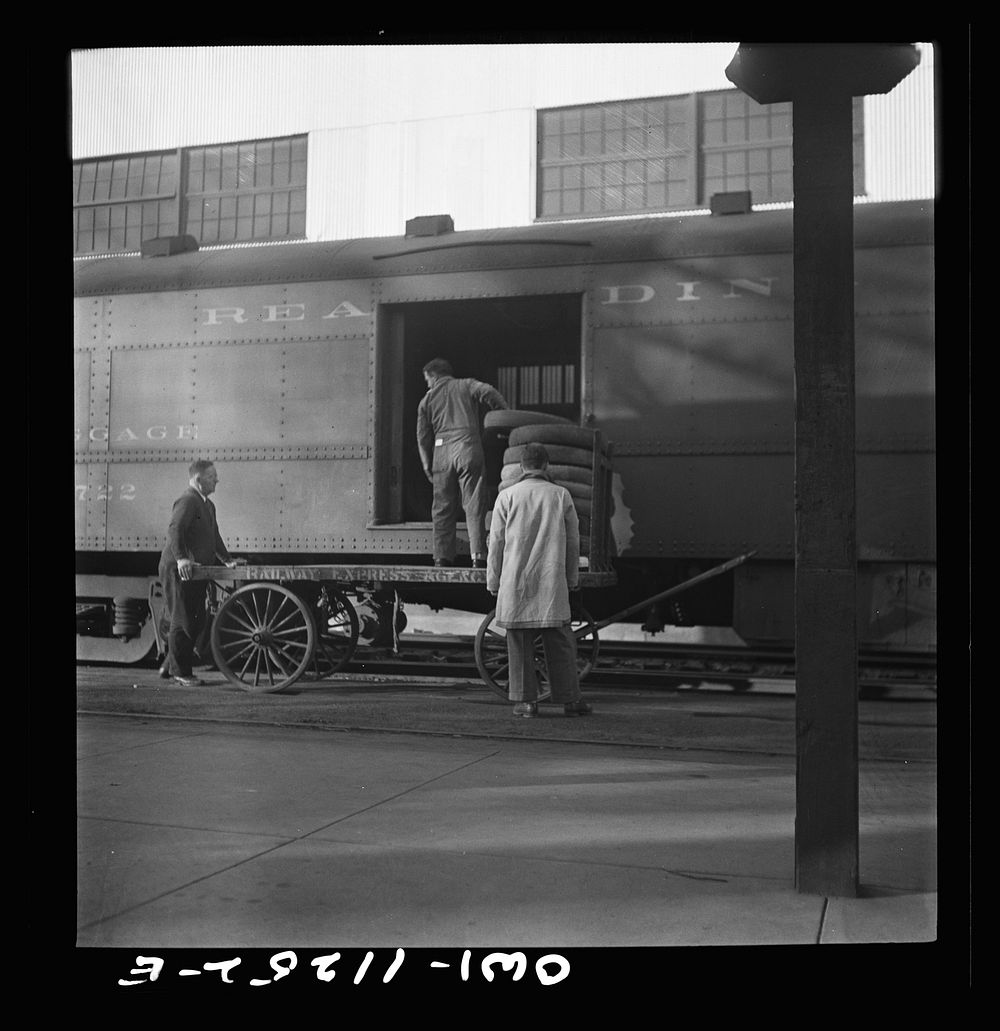 Lititz, Pennsylvania. Mr. O.K. Bushong, express agent (left), supervising the loading of old tires to be shipped to…