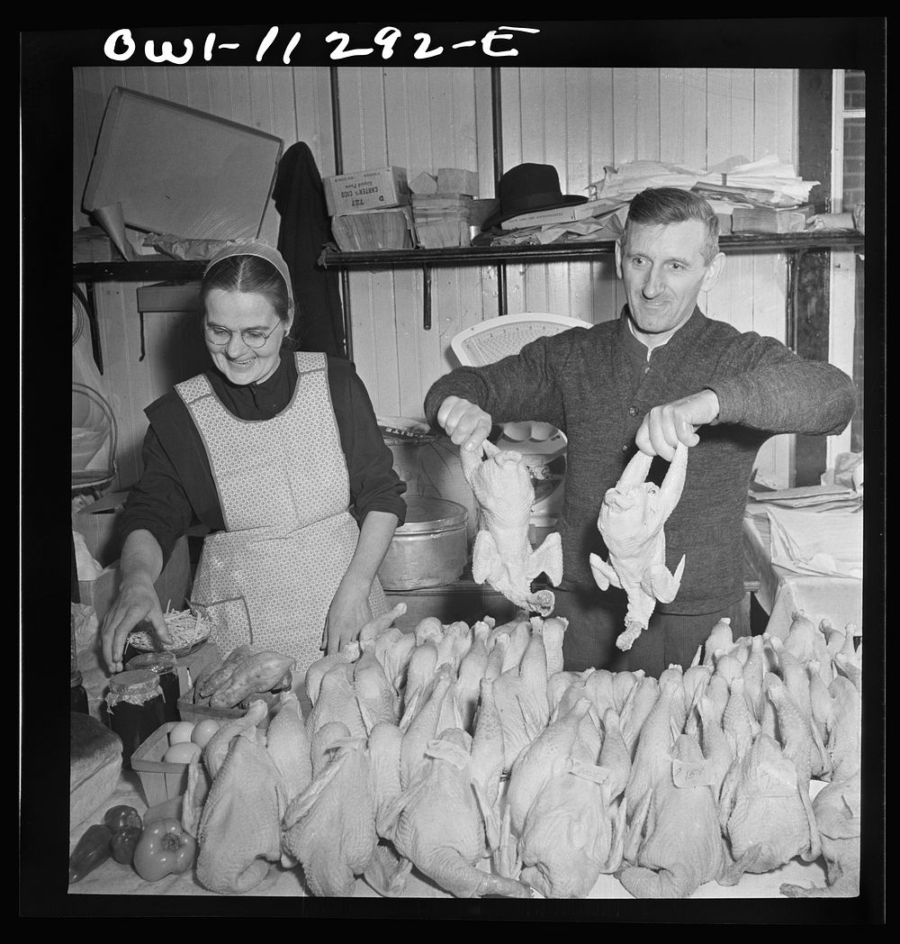 Lititz, Pennsylvania. Mennonite farmer and wife selling fowl at the farmer's market. Sourced from the Library of Congress.