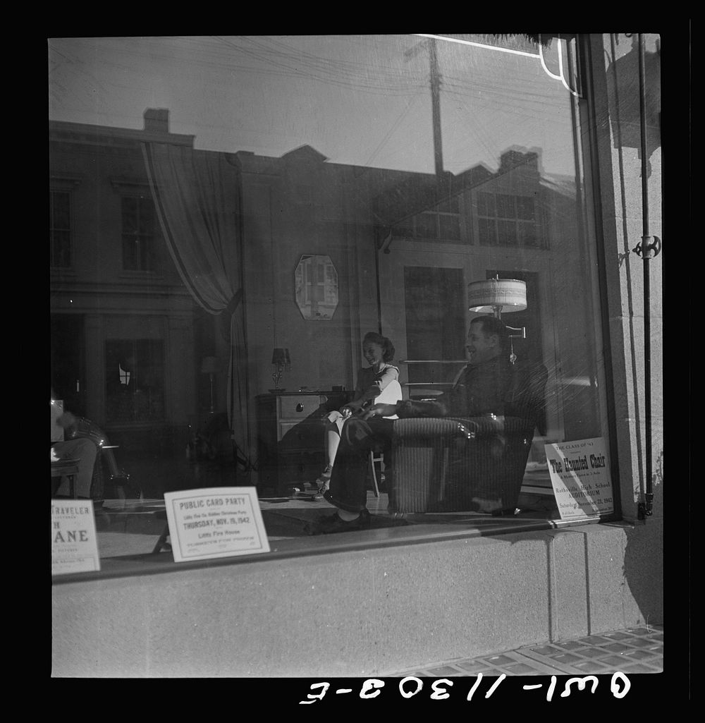 Lititz, Pennsylvania. During an air raid alarm, workers in this furniture store sat in the window display. Sourced from the…