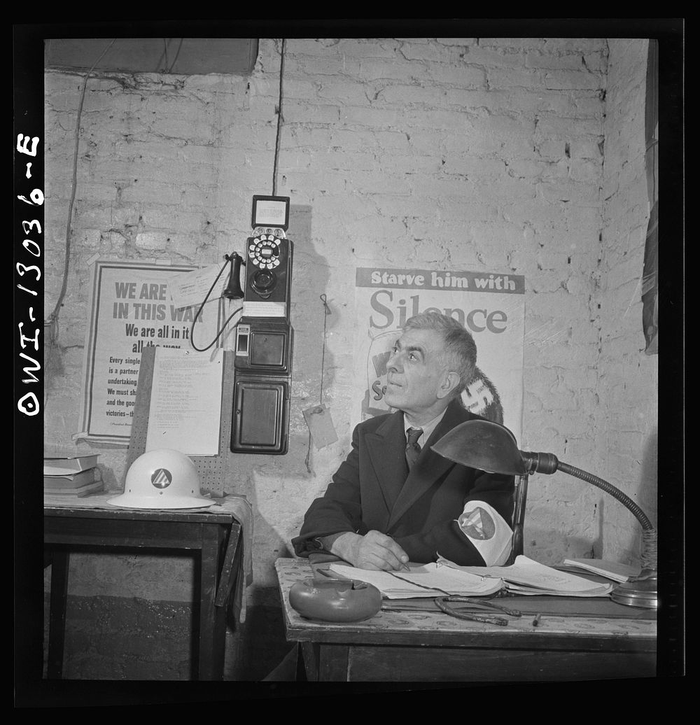 New York, New York. Italian-American shoemaker on duty as an air raid warden at sector headquarters on Waverly Place.…