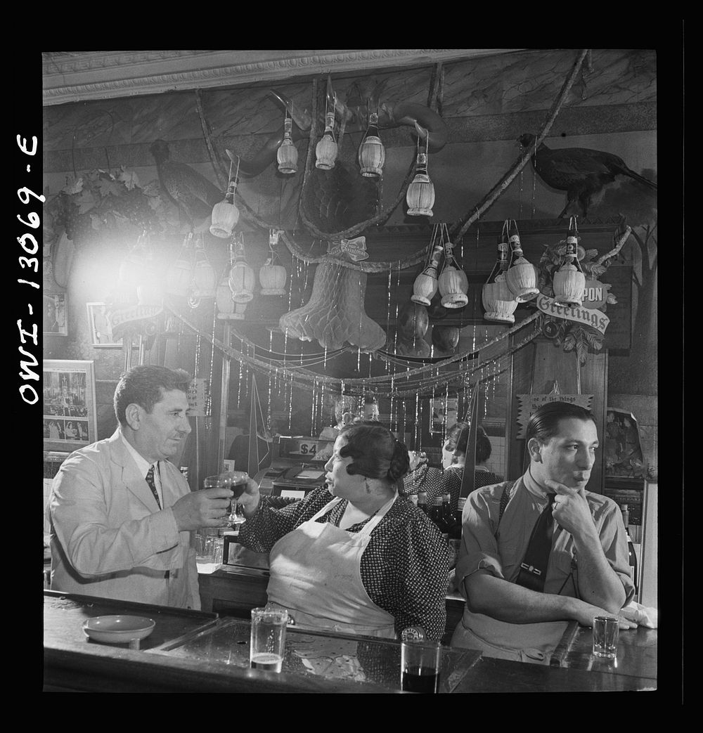 New York, New York. Mr. and Mrs. Di Costanzo at the bar of their restaurant on Mulberry Street on New Year's Eve. Sourced…