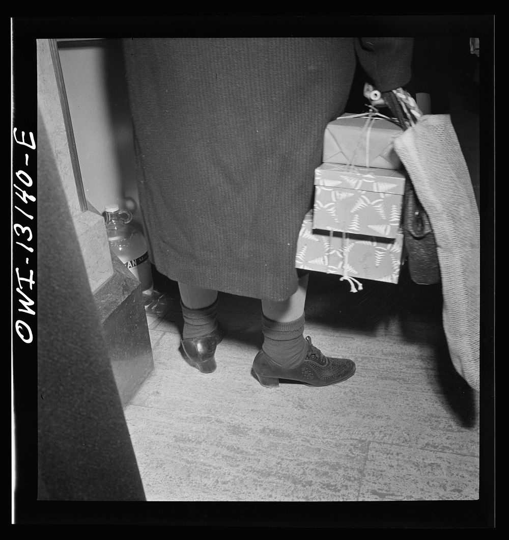New York, New York. A shopper in R. H. Macy and Company department store during the week before Christmas. Sourced from the…