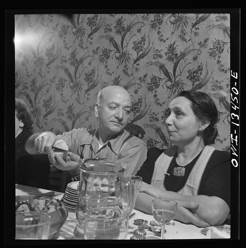 New York, New York. Mr. and Mrs. Martinetti at Sunday dinner at their home in the Bronx. Sourced from the Library of…