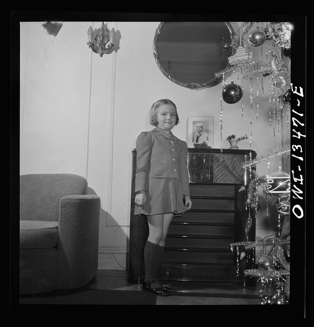 [Untitled photo, possibly related to: New York, New York. Martinetti grandchild and her aunt at the Christmas tree. The pin…