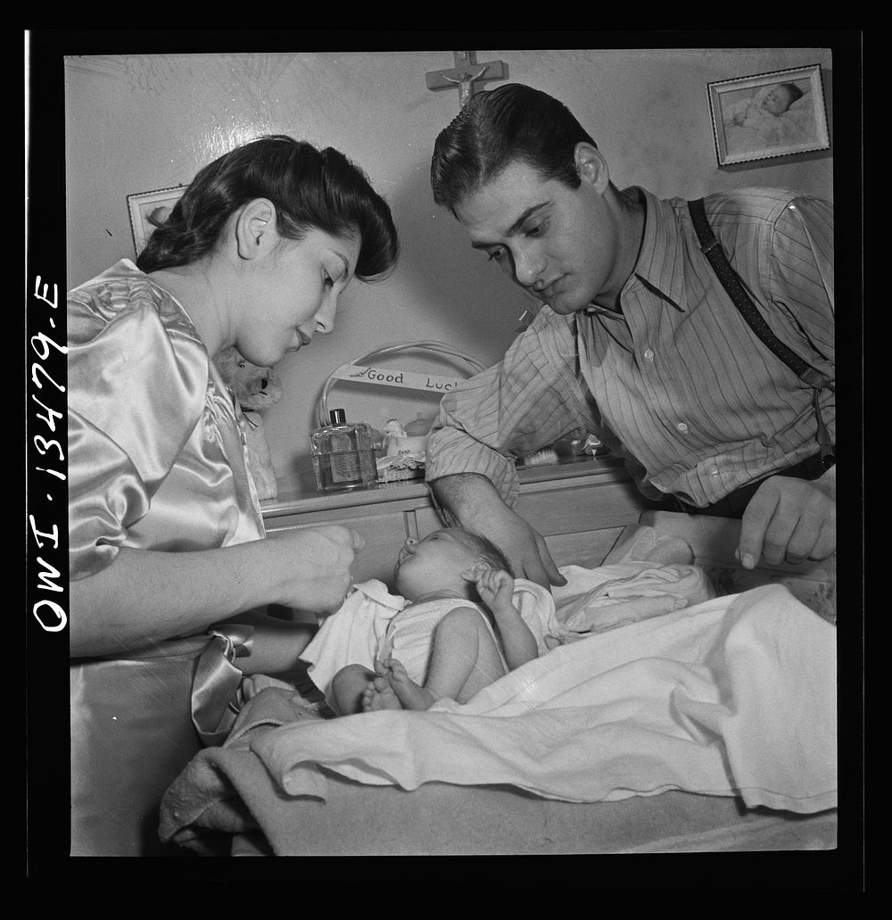 New York, New York. Mr. and Mrs. Frank Romano dressing their month-old baby for bed. Sourced from the Library of Congress.