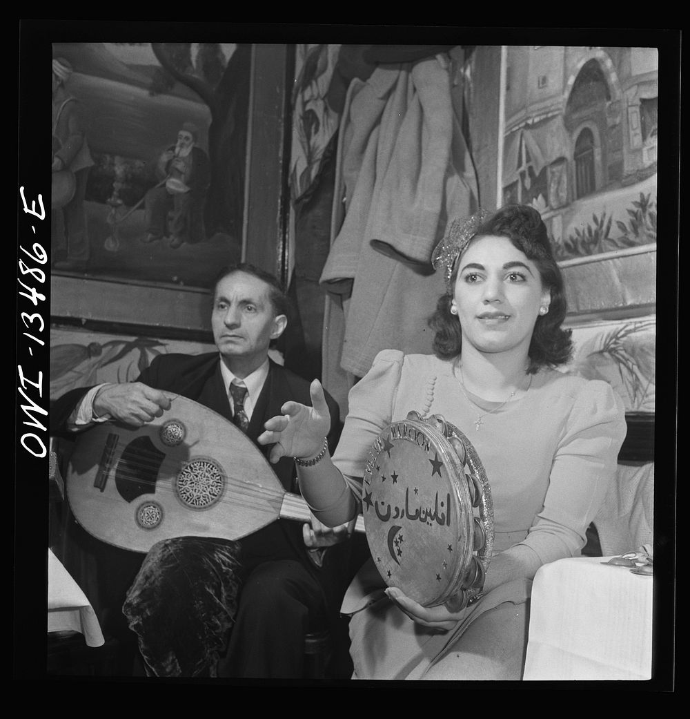 New York, New York. Orchestra in a Turkish nightclub on Allen Street. The girl plays a tambourine between dances. Sourced…