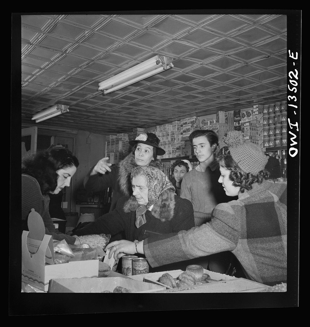 New York, New York. Customers in a grocery store on Mulberry Street. Italian, Jewish and Chinese people live in this…