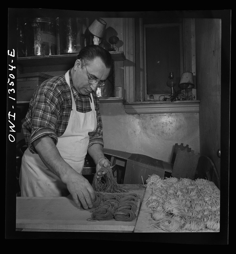 New York, New York. Laying out portions of freshly-made green and white noodles in the kitchen of the Sixty-Eight restaurant…