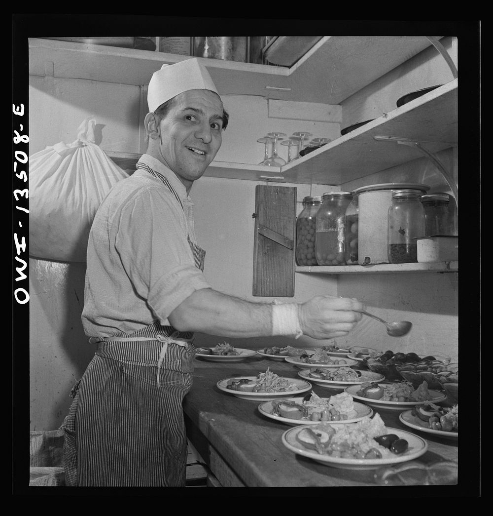 New York, New York. Kitchen worker making antipasto at Sixty-Eight restaurant on Fifth Avenue at Thirteenth Street. Sourced…