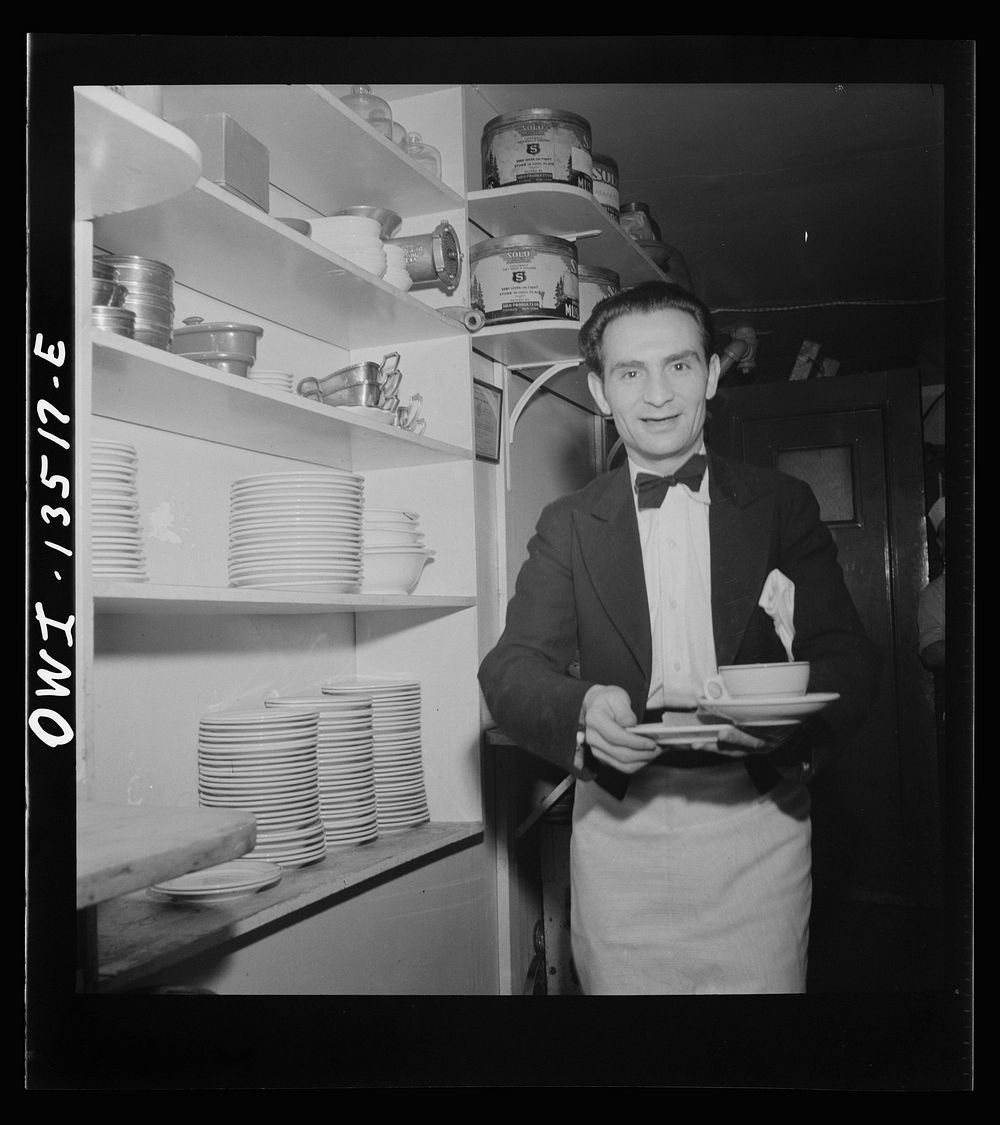 New York, New York. Waiter at the Sixty-Eight restaurant on Fifth Avenue at Thirteenth Street. Sourced from the Library of…