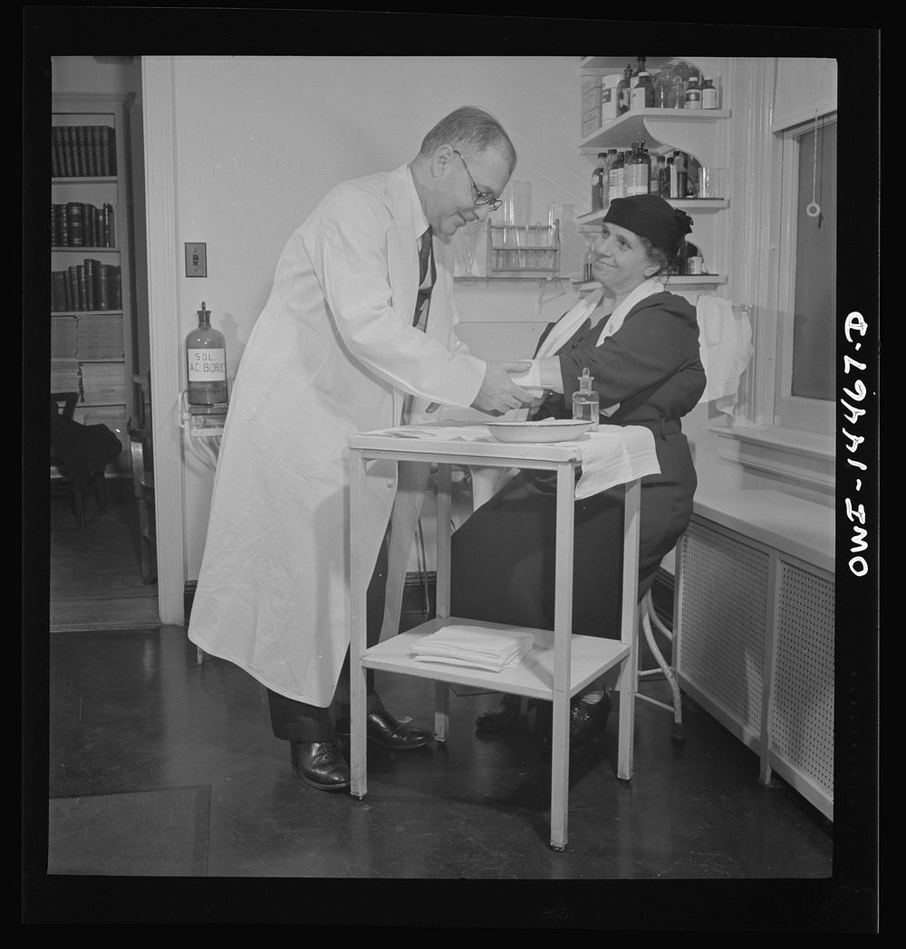 New York, New York. Italian surgeon bandaging a patient's arm. Sourced from the Library of Congress.
