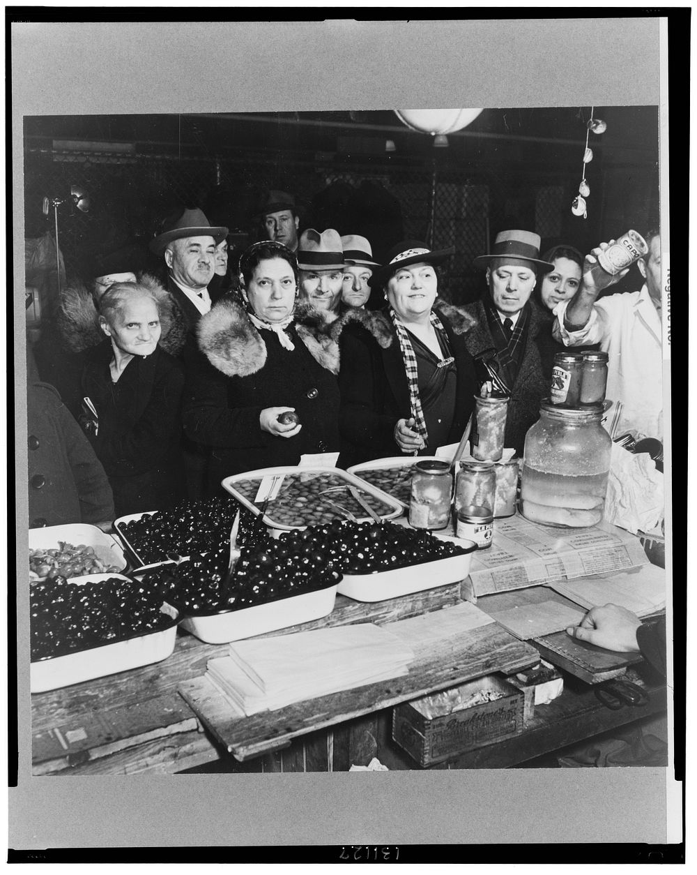 New York, New York. Italian and Jewish customers in the First Avenue market at Tenth Street. Sourced from the Library of…