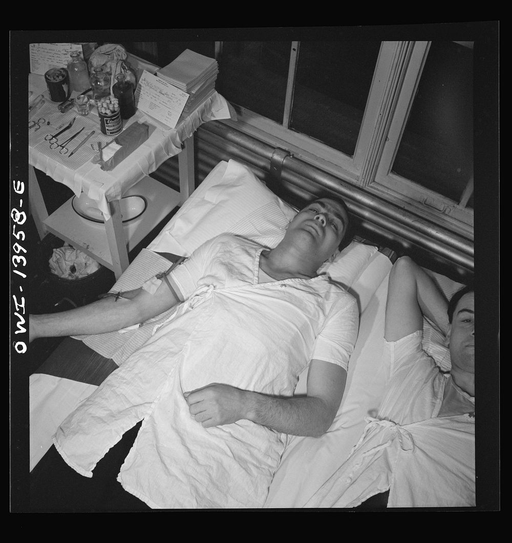 [Untitled photo, possibly related to: New York, New York. Italian-American fireman giving pint of blood to the Red Cross].…