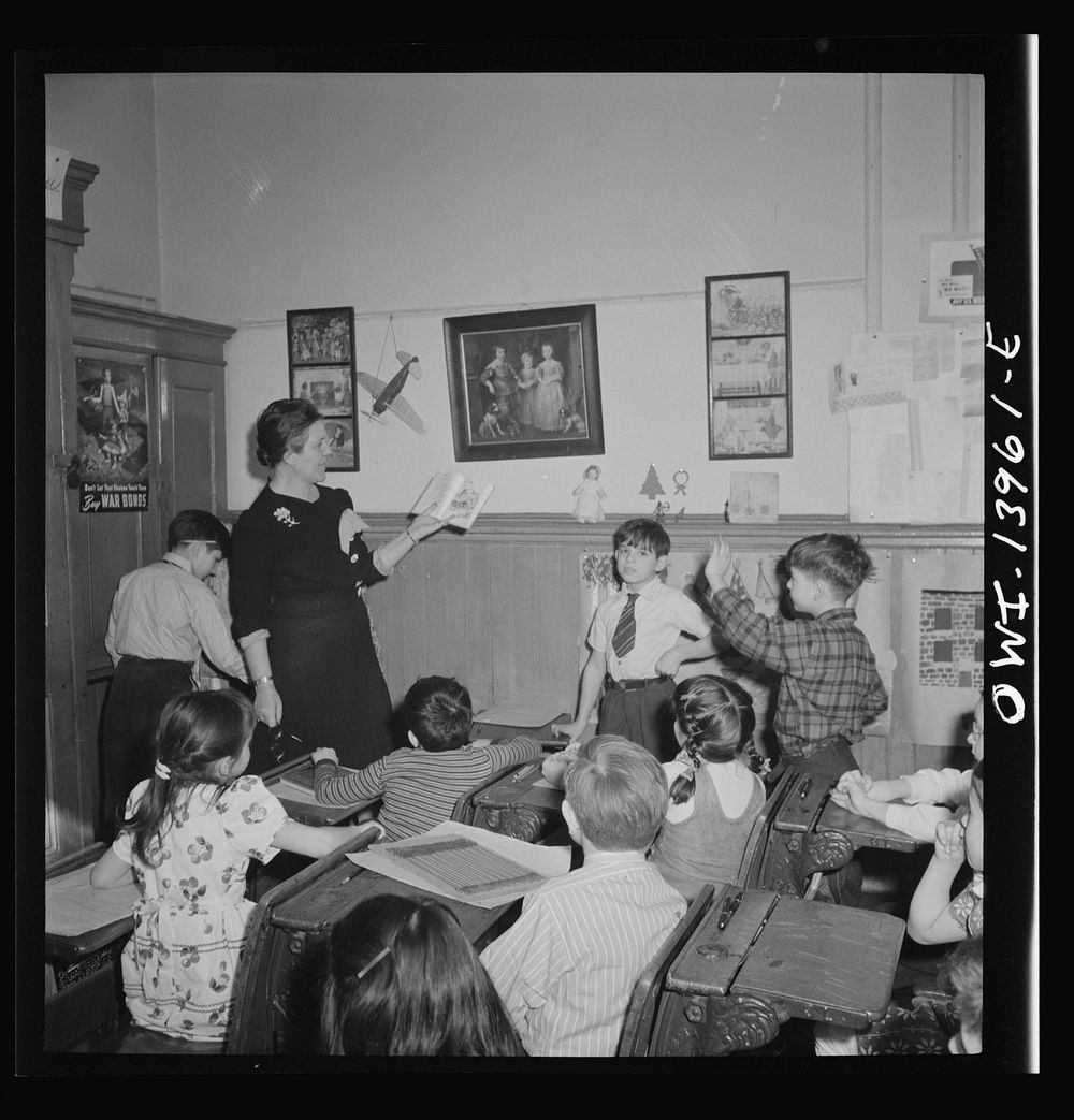 New York, New York. Class in Public School Eight on King Street, discussing a book entitled "We love America," brought to…