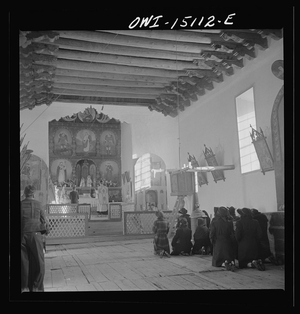 Trampas, New Mexico. Father Cassidy conducting mass at a church which was built in 1700 and is best-preserved colonial…