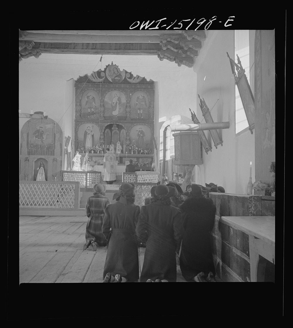 [Untitled photo, possibly related to: Trampas, New Mexico. Father Cassidy conducting mass at a church which was built in…