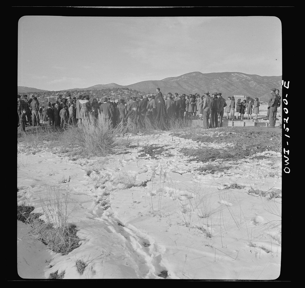 [Untitled photo, possibly related to: Penasco, New Mexico. Father Cassidy speaking at the dedication of the new building for…
