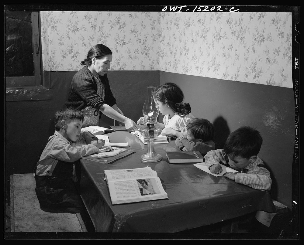 Trampas, New Mexico. Mrs. Maclovia Lopez, can read and write English well; she also keeps the family books in the evening…