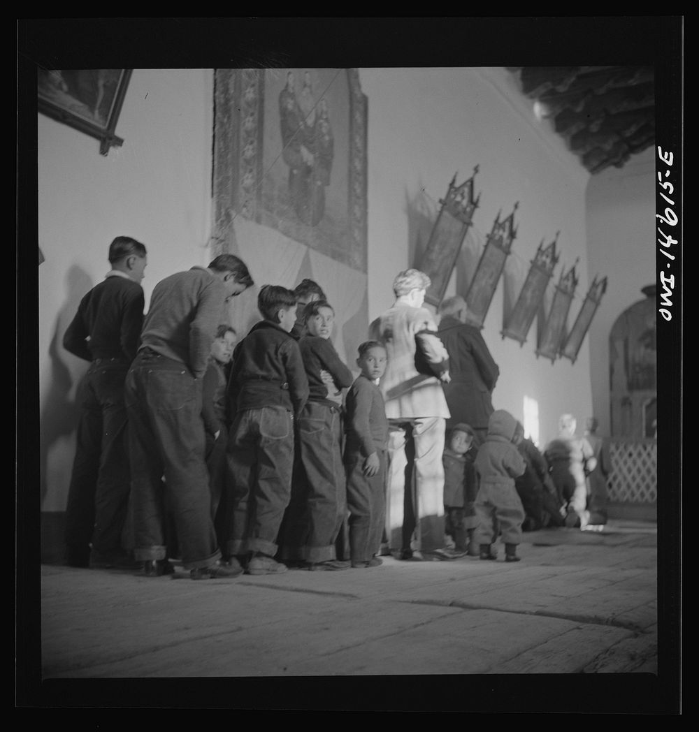 [Untitled photo, possibly related to: Trampas, New Mexico. Father Cassidy conducting mass at a church which was built in…
