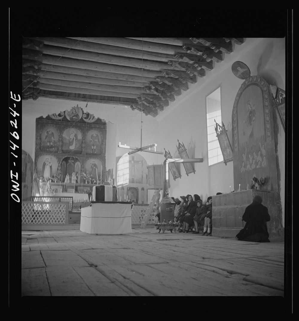 [Untitled photo, possibly related to: Trampas, New Mexico. Service at the mission church. The painting on the retablo…