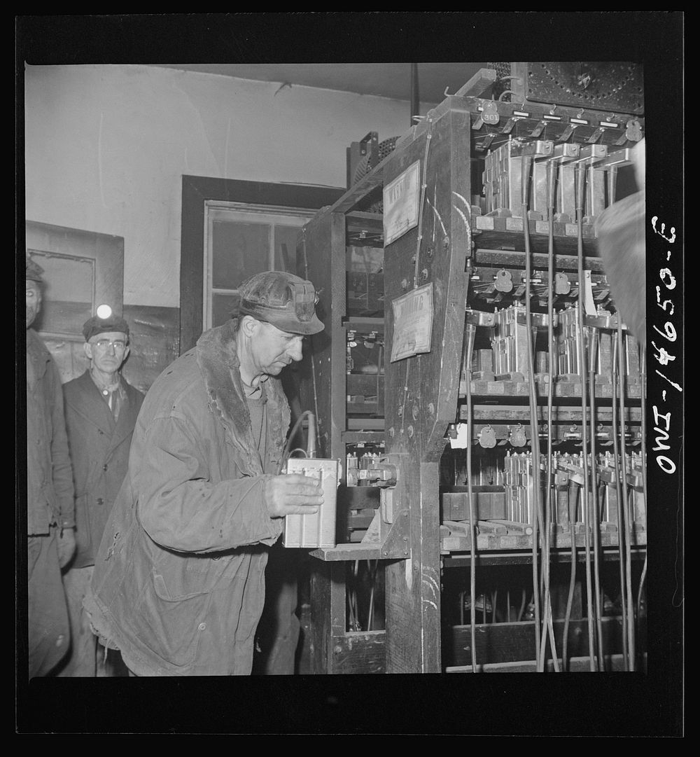 Pittsburgh (vicinity), Pennsylvania. Montour Number Four mine of the Pittsburgh Coal Company. Miners in the room where lamps…