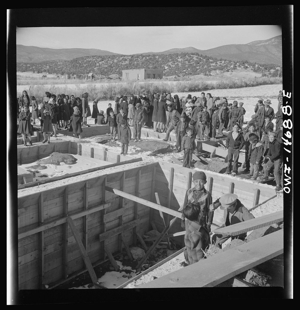 [Untitled photo, possibly related to: Penasco, New Mexico. Crowds gathering at the dedication ceremony of the new building…