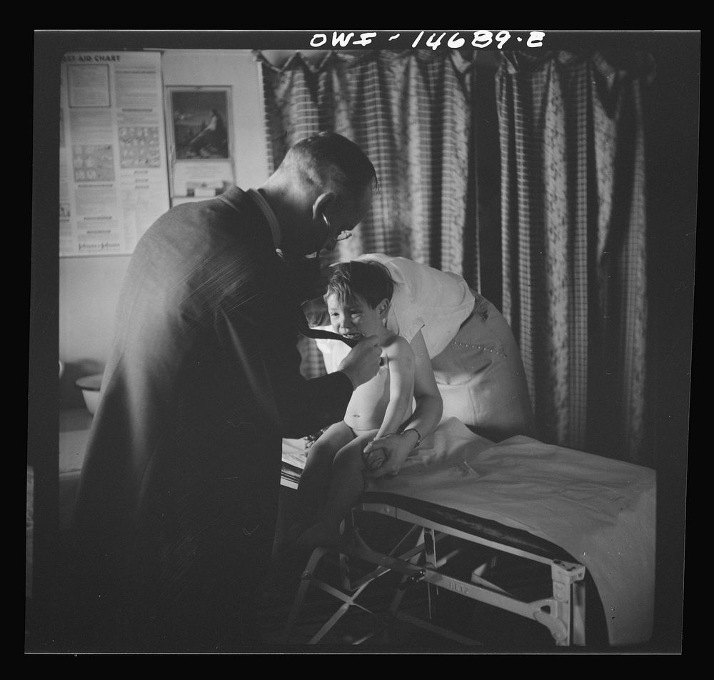 [Untitled photo, possibly related to: Penasco, New Mexico. Doctor Onstine making an examination in the clinic operated by…