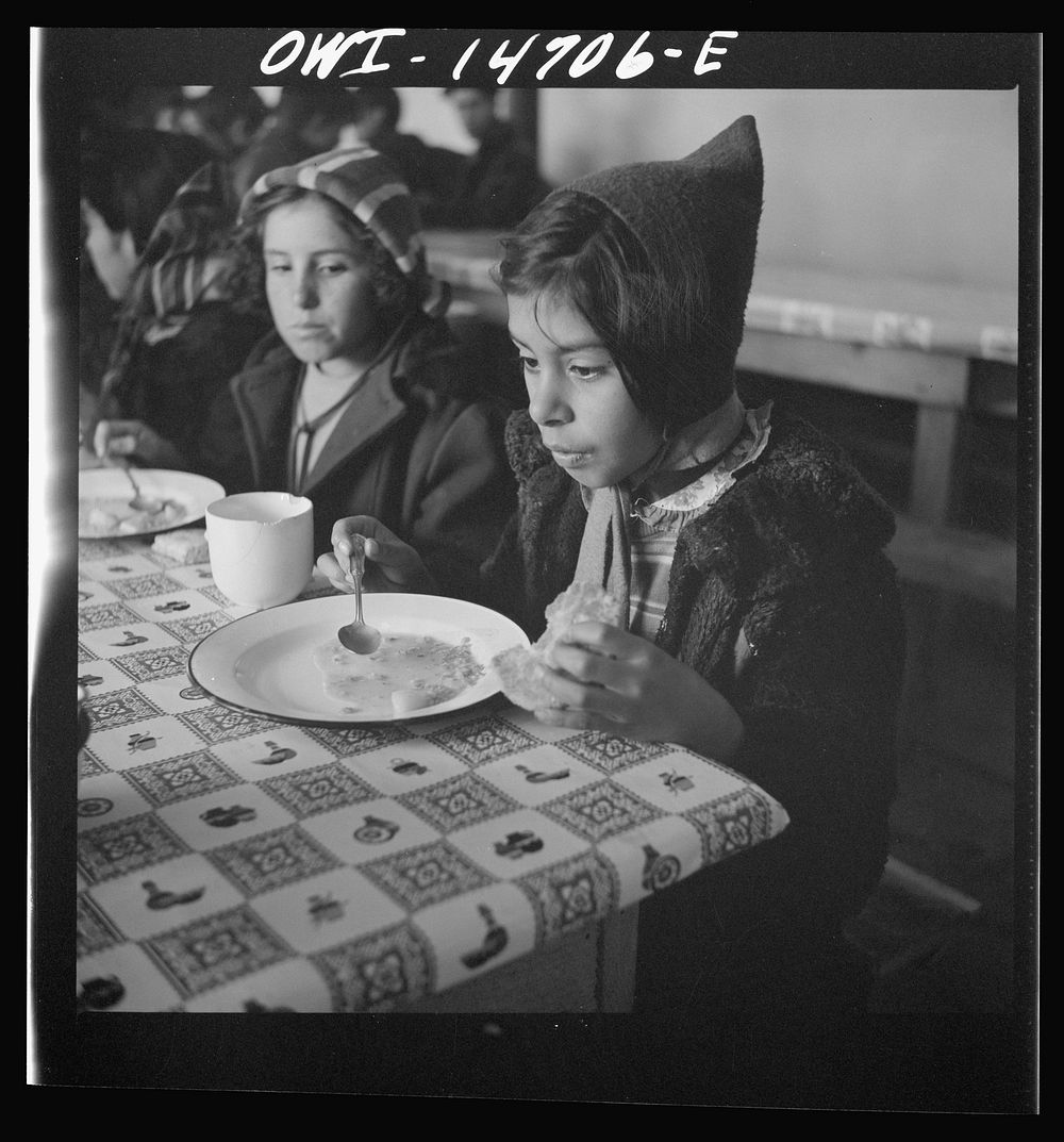 Penasco, New Mexico. A grade school student eating a hot lunch. Sourced from the Library of Congress.