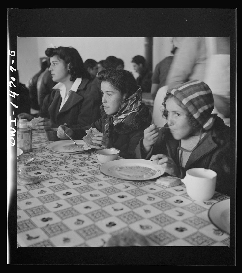 [Untitled photo, possibly related to: Penasco, New Mexico. A grade school student eating a hot lunch]. Sourced from the…