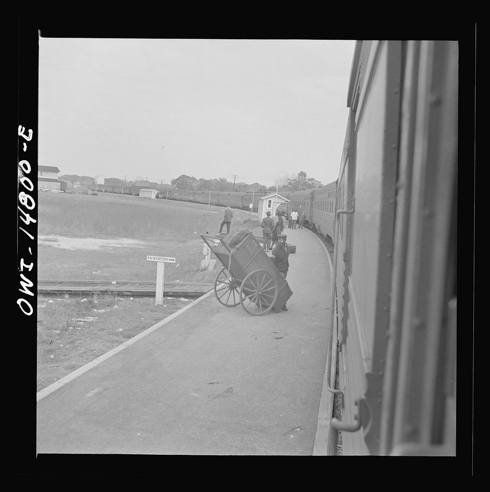 [Untitled photo, possibly related to: Saint Augustine, Florida. Trainman signalling from a "Jim Crow" coach]. Sourced from…