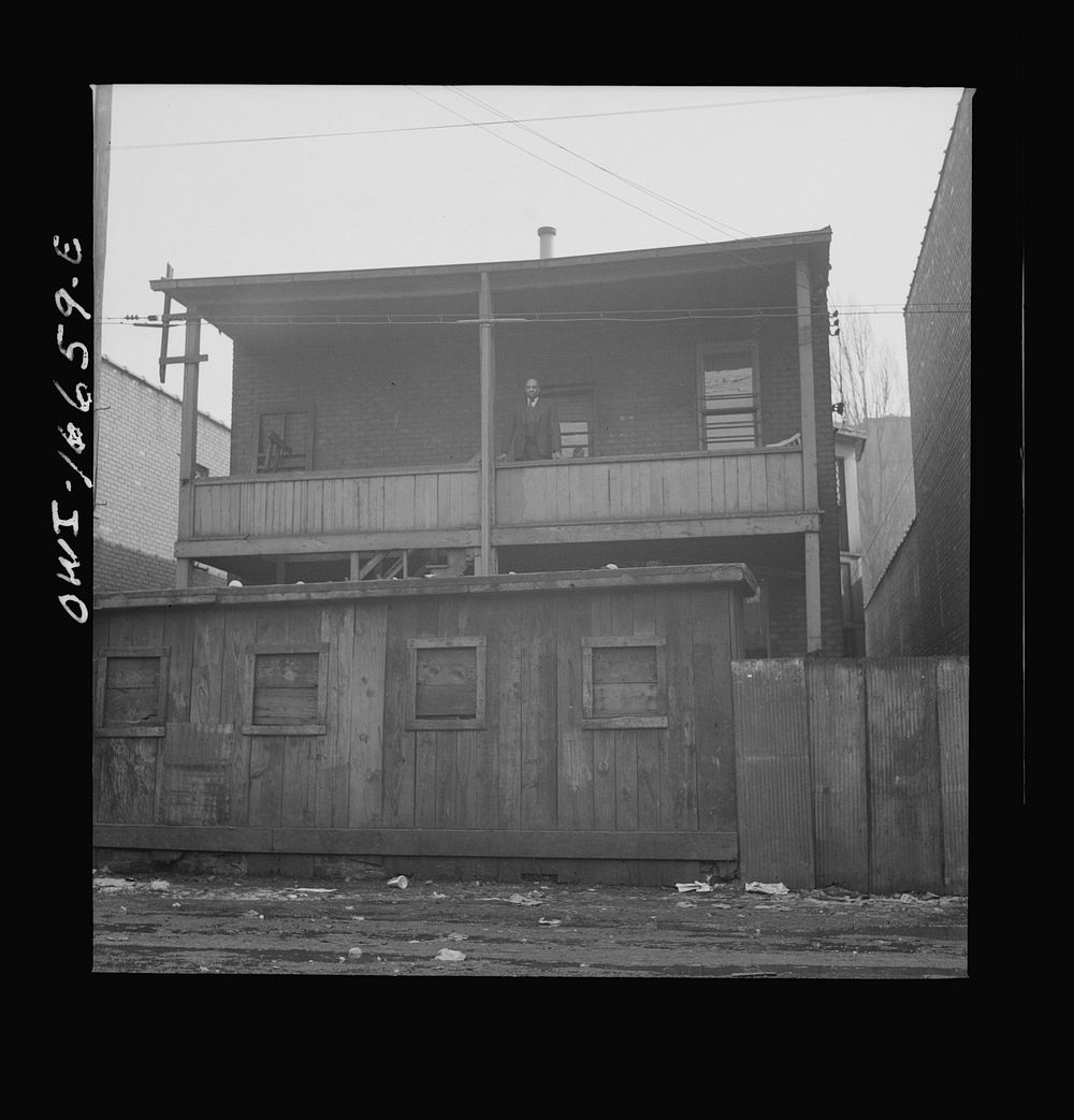 Detroit, Michigan. Back view of a 's home. These are conditions under which families originally lived before moving to the…