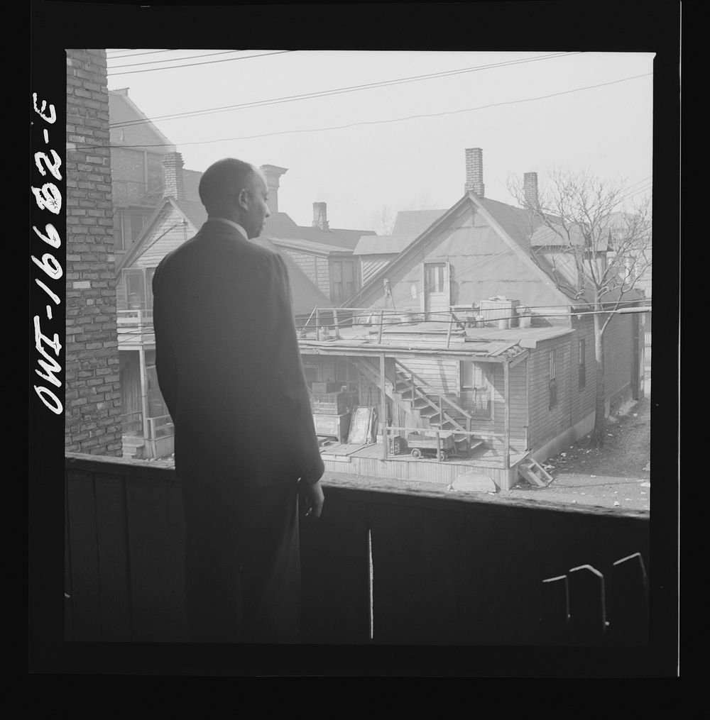 Detroit, Michigan. Looking over slum houses. These are conditions under which families originally lived before moving to the…