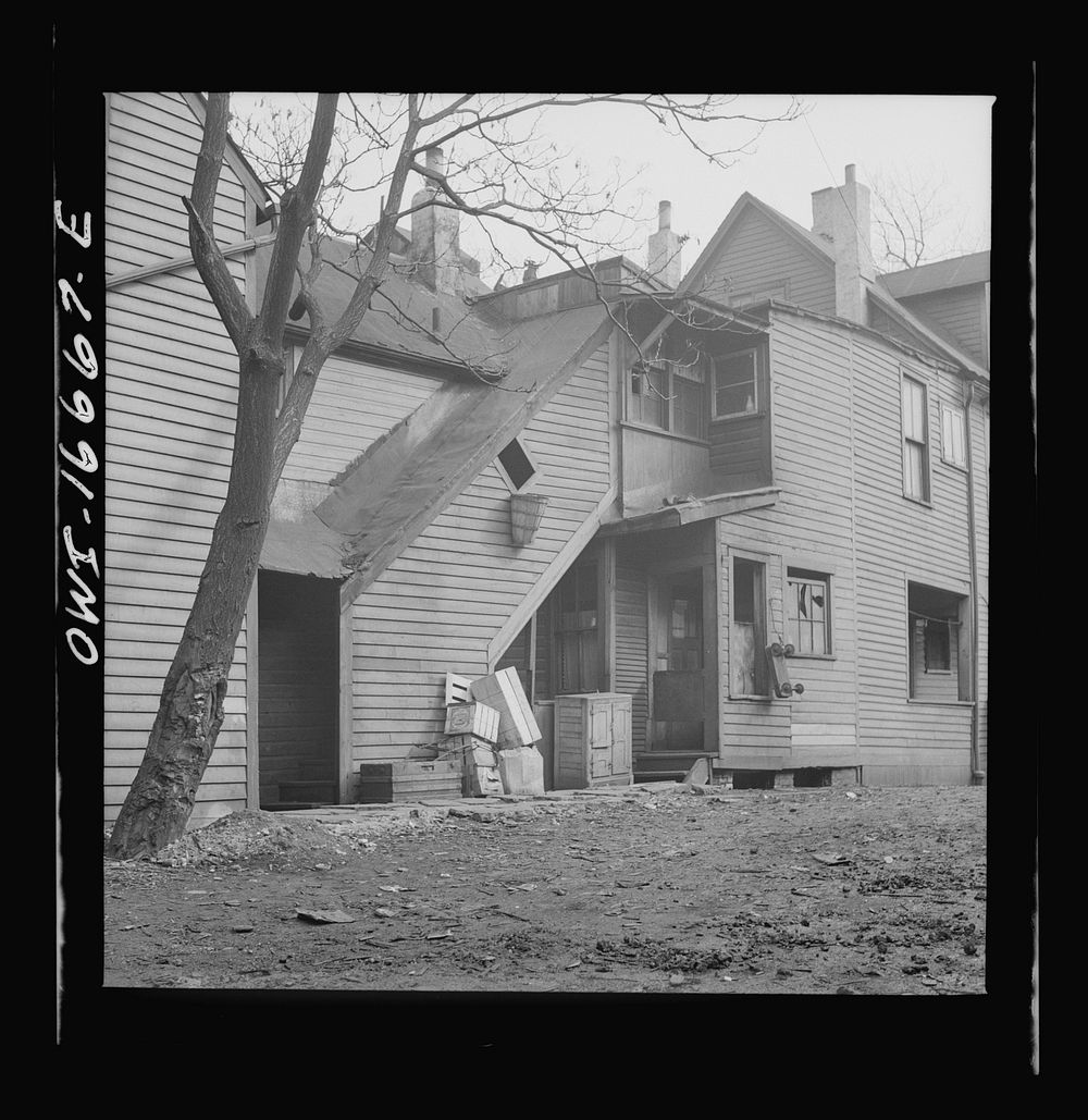 Detroit, Michigan. Seven  families live in this di lapidated house. These are conditions under which families originally…