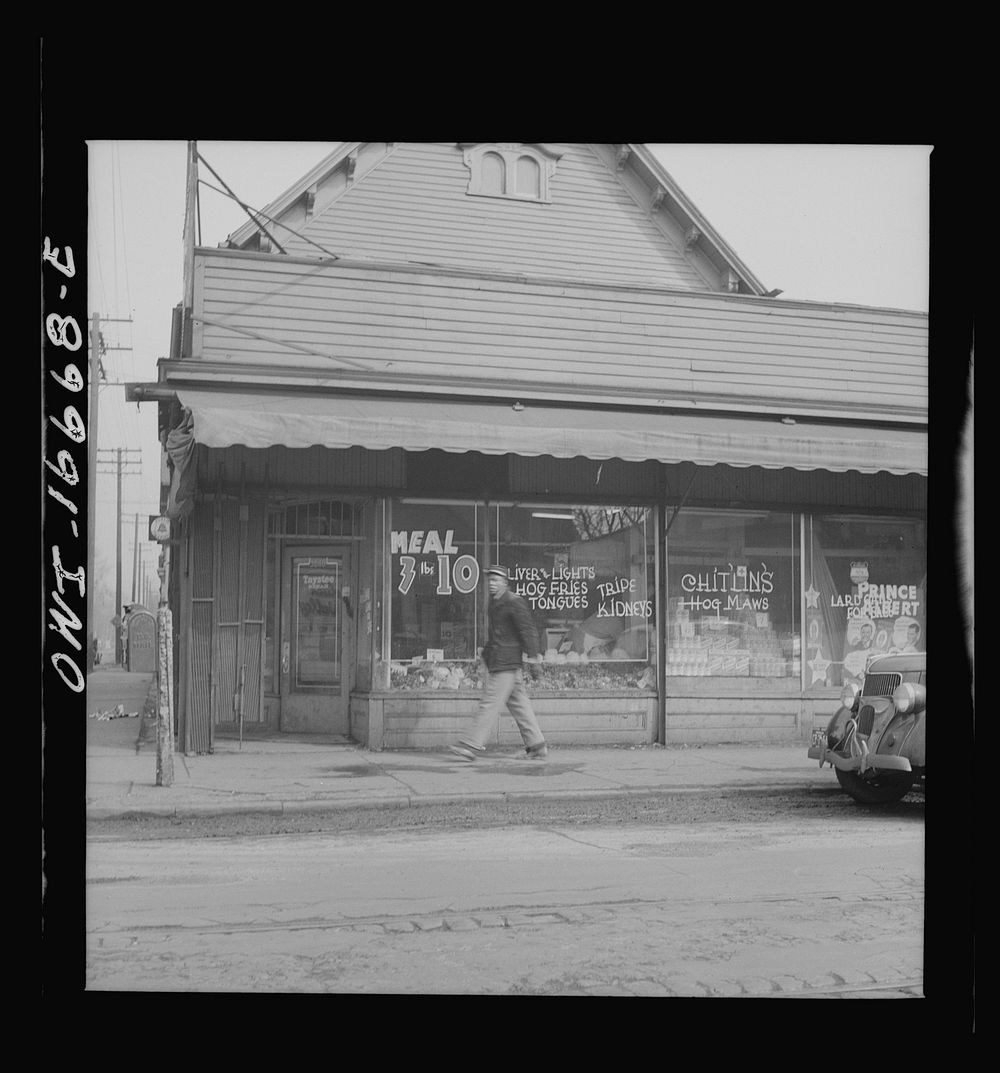 Detroit, Michigan. Sign in a grocery window in the  district: "chitlins and hogjaws". Sourced from the Library of Congress.