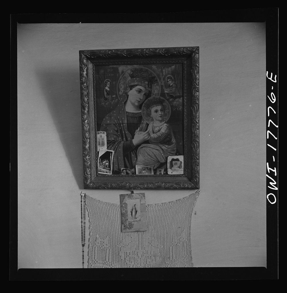 Trampas, New Mexico. Every room in the home of Juan Lopez, the majordomo (mayor), has three or four religious pictures.…