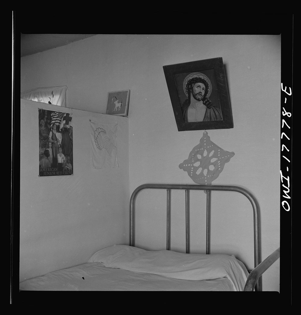 Trampas, New Mexico. Every room in the home of Juan Lopez, the majordomo (mayor), has three or four religious pictures.…
