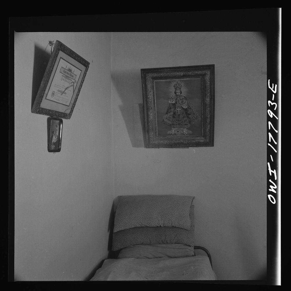 Trampas, New Mexico. Grade school diploma of Cora Romero and prints on the wall of one of the bedrooms of Juan Lopez, the…