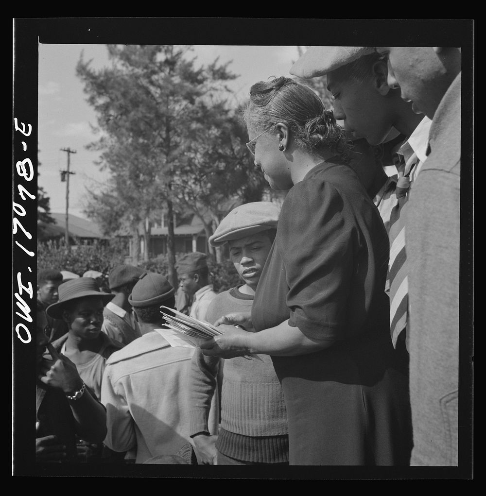 [Untitled photo, possibly related to: Daytona Beach, Florida. Bethune-Cookman College. Mrs. Shaw handing out mail to college…