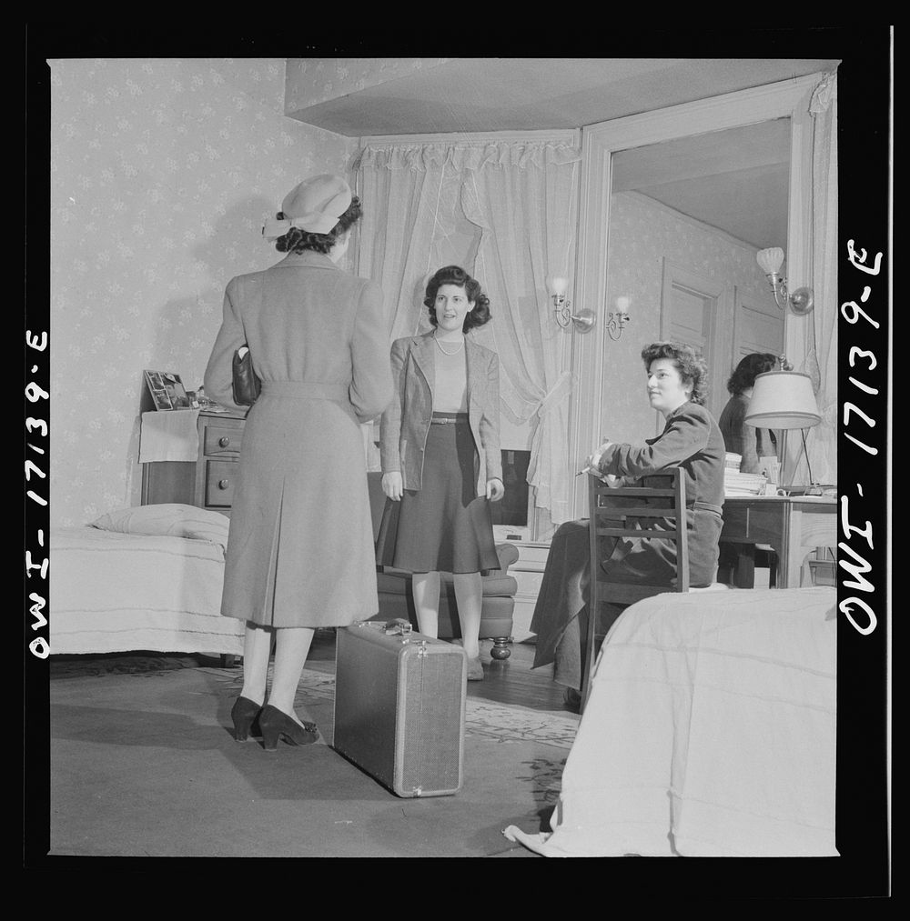 Washington, D.C. A girl employed by the U.S. government, a new arrival at a boardinghouse, being greeted by her roommates.…