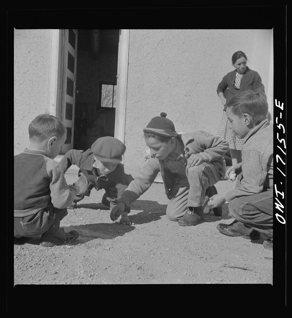 [Untitled photo, possibly related to: Trampas, New Mexico. Playing marbles in the dooryard of the home of Juan Lopez, the…