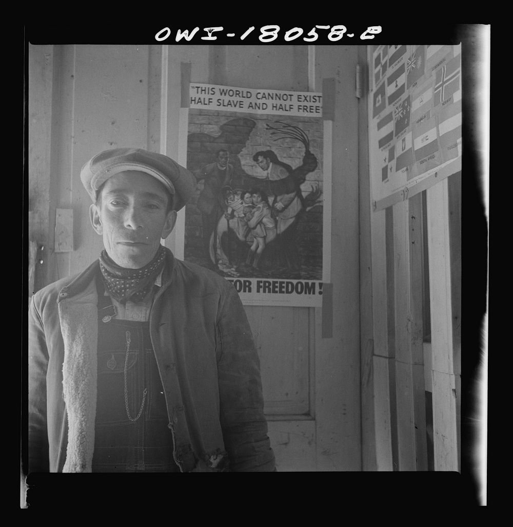 A Spanish-American standing in the door of the general store. Trampas, New Mexico. Sourced from the Library of Congress.