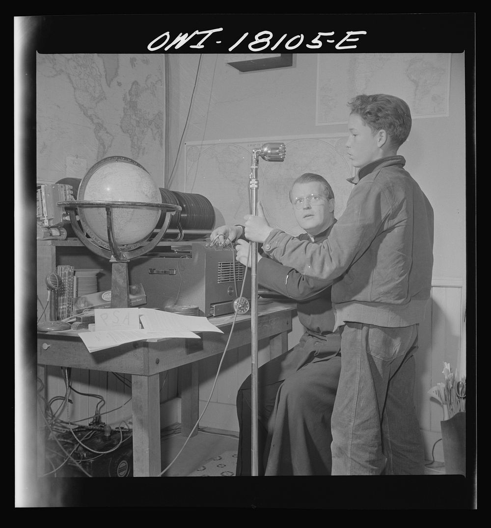 Questa, New Mexico. Local Spanish-American boy broadcasting native songs over the parish broadcasting system. Sourced from…